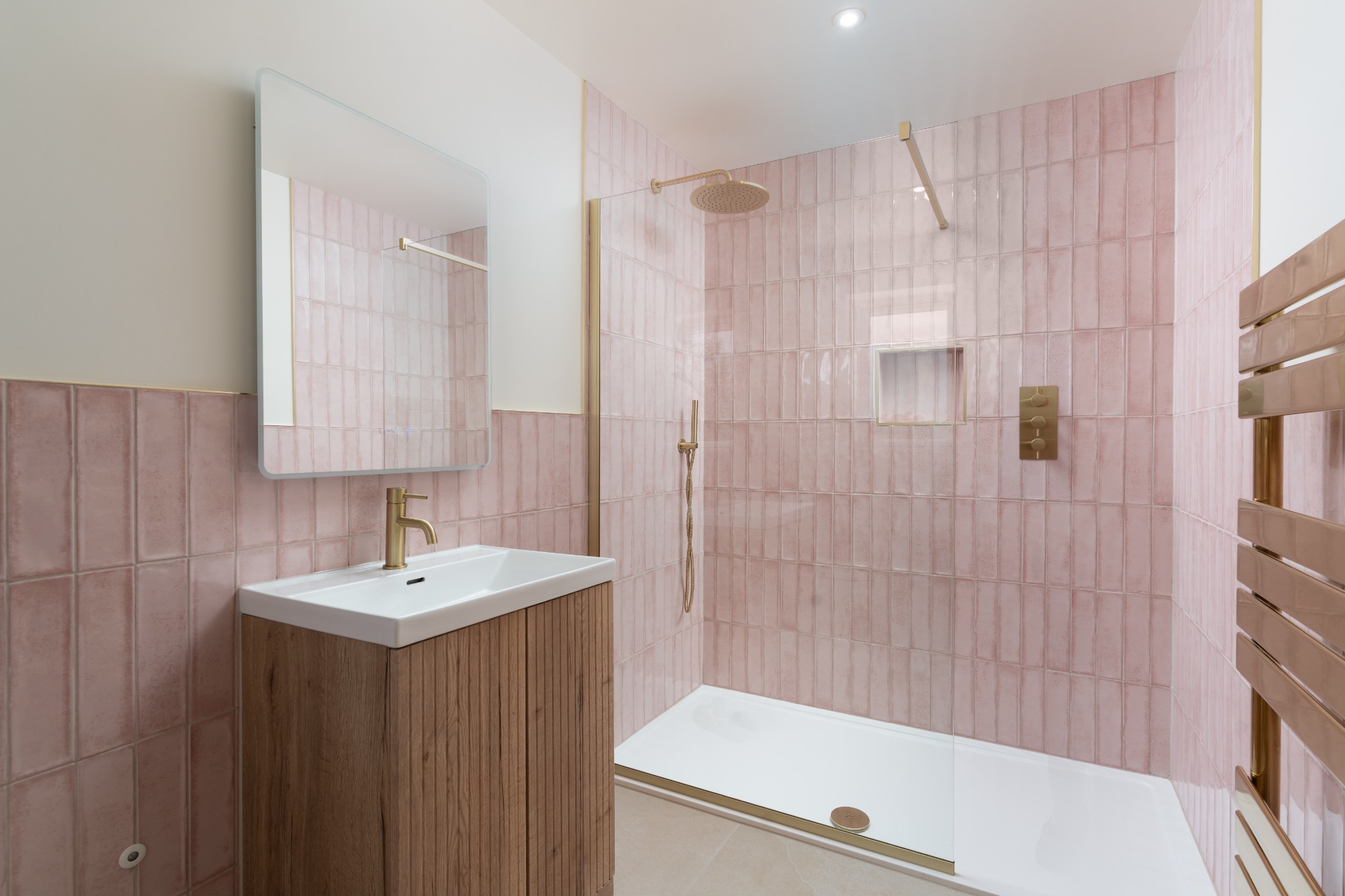 Pink-tiled shower room