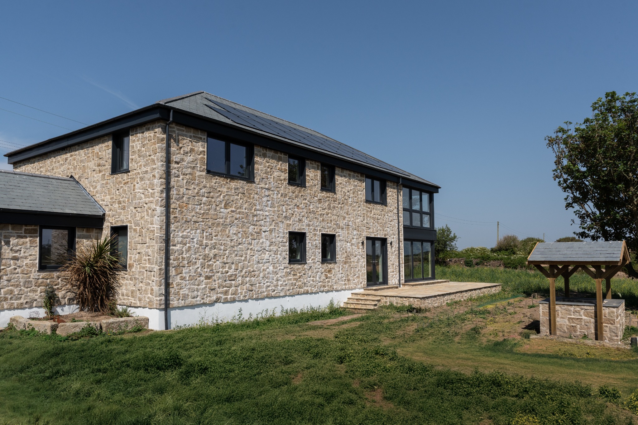 Long stone elevation of the completed house