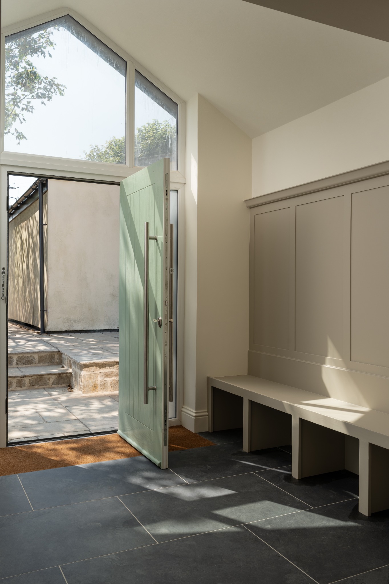 Boot room with fitted bench and open external door