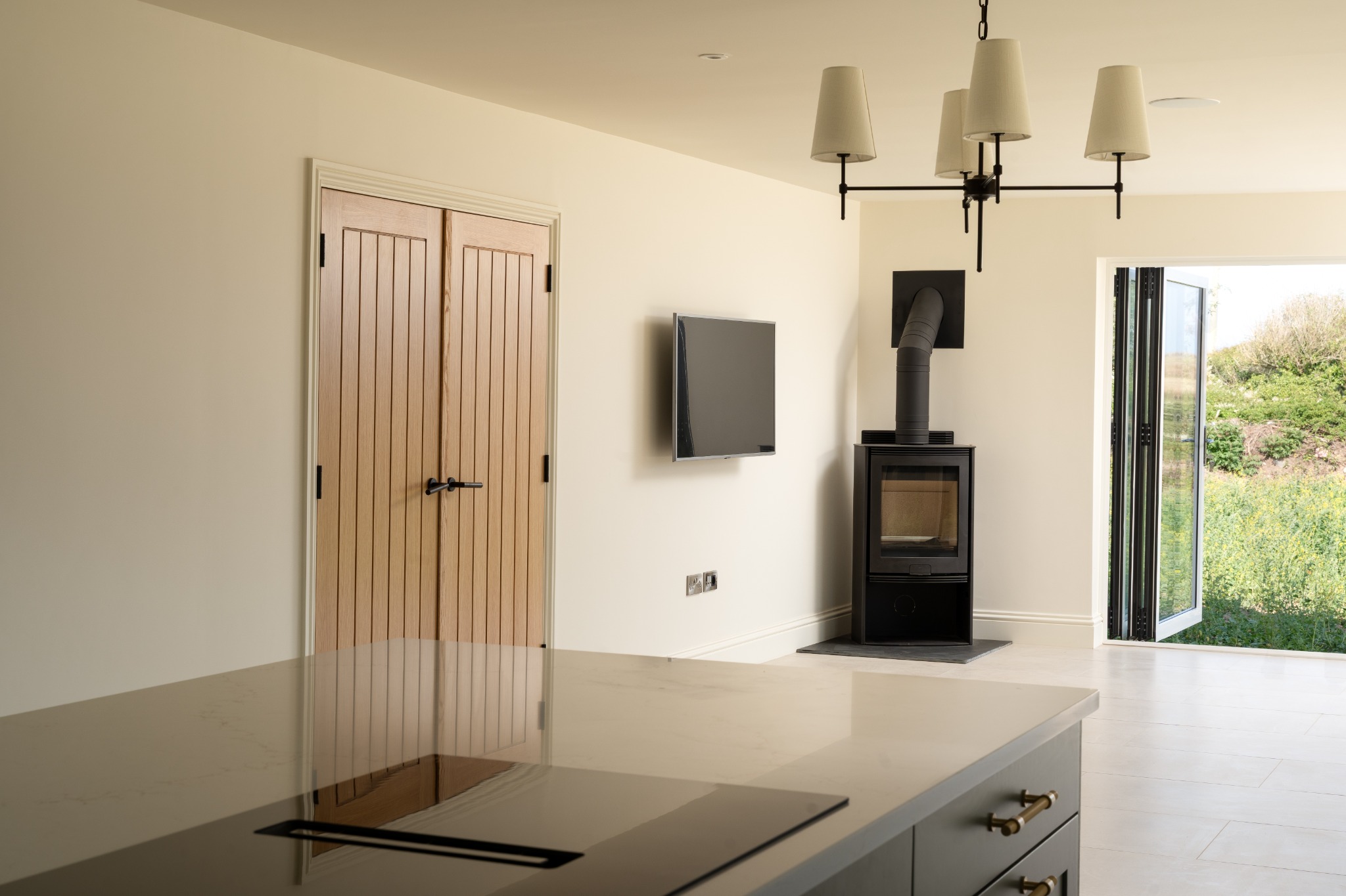 Living area with stove and oak doors