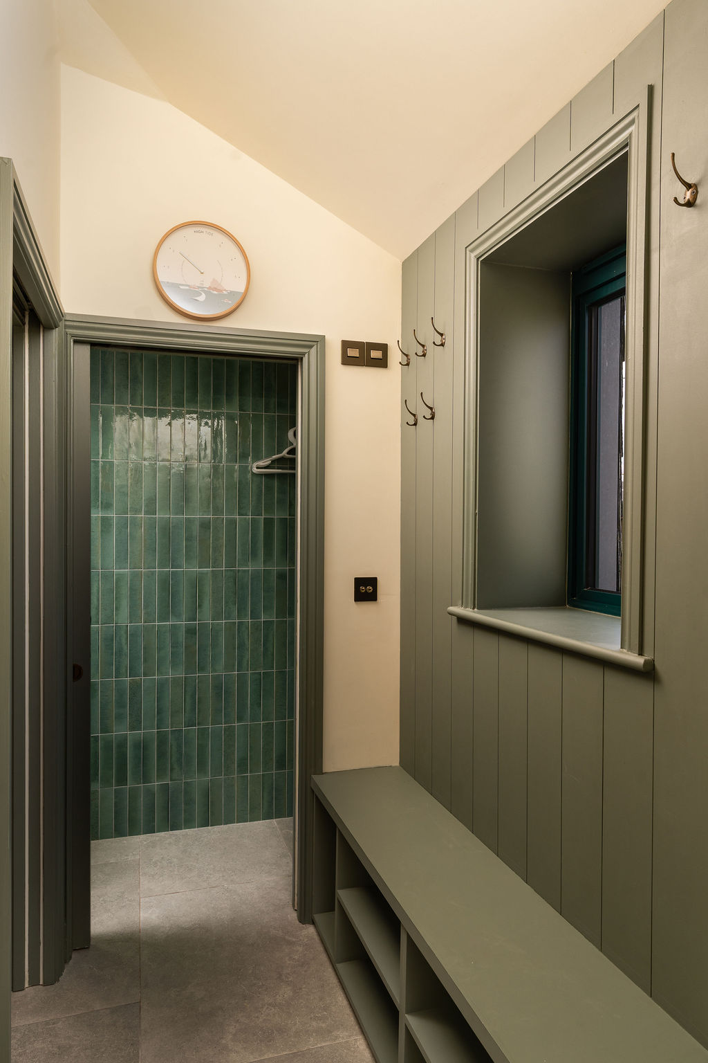 Bespoke boot room seating and storage in muted green