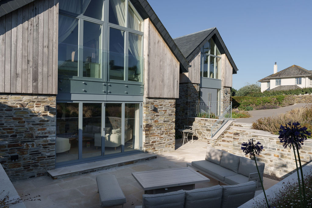 Whimbrels glazed gable with oak cladding and Cornish stone