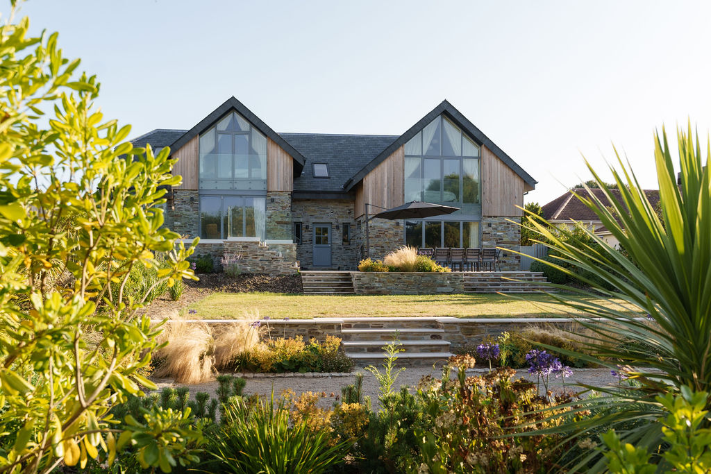 Completed Whimbrels home framed by its coastal garden